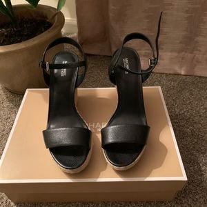Michale Kors wedge sandals. Very comfortable! Worn a few times.